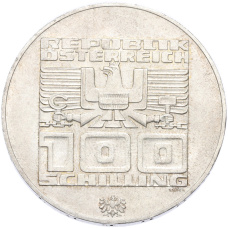 Монета 100 шиллингов 1976 года Австрия «XII зимние Олимпийские Игры 1976 в Инсбруке — Здания и Олимпийская эмблема» (реверс)